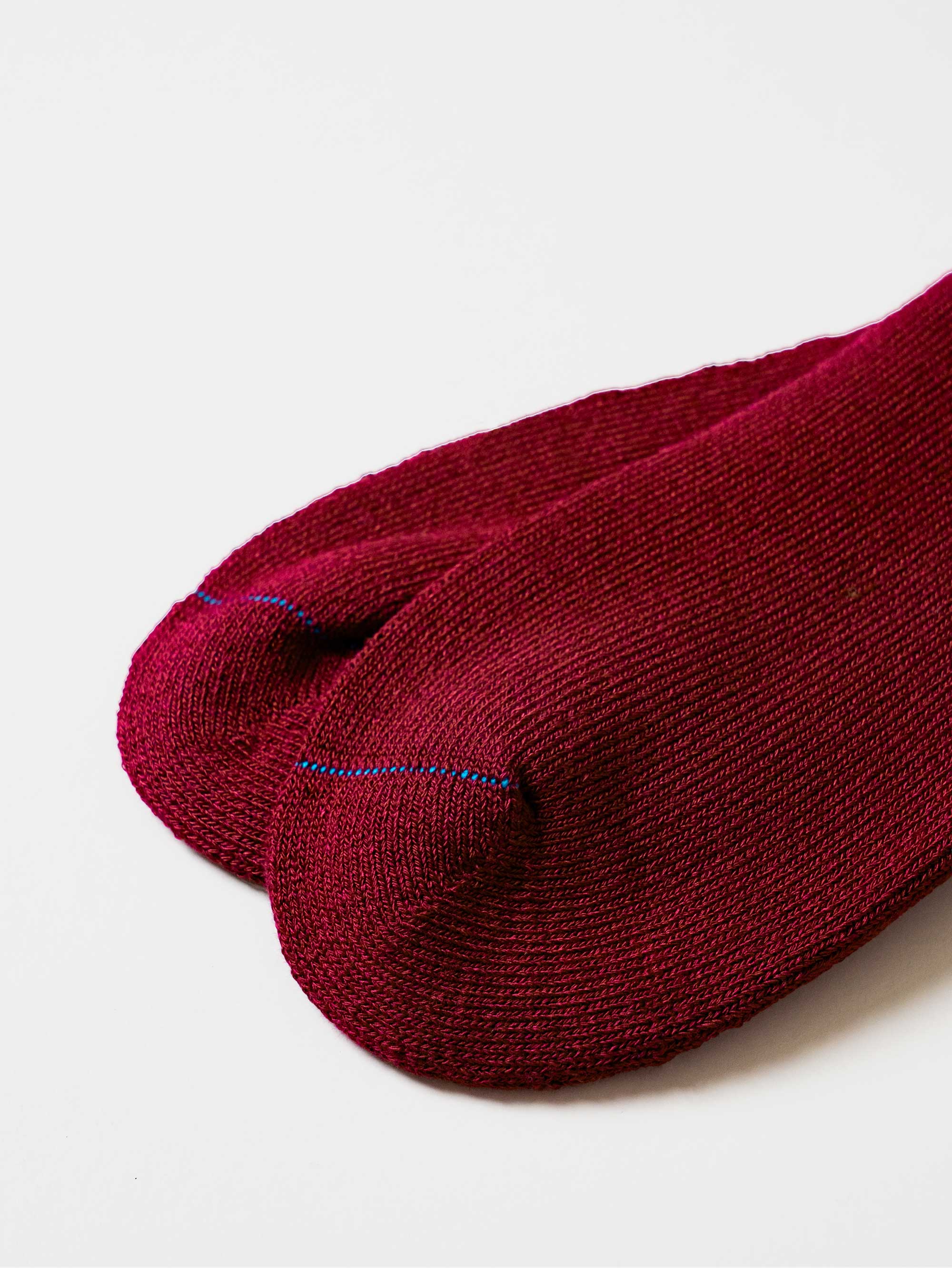 Maroon bamboo work sock on a white background